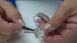 How to change the ear wax filter on hearing aids - Alpha Clinics